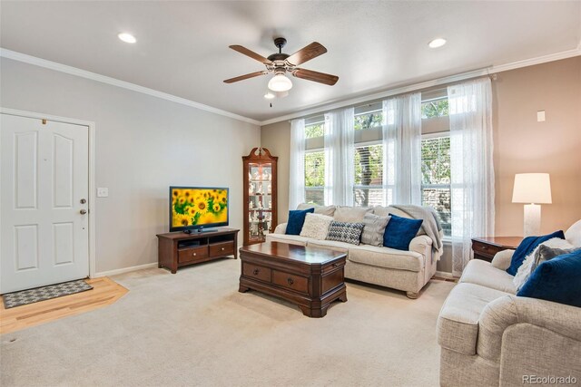 15501 E 112th Ave Unit 33D, Commerce City, CO 80022 - living area with baseboards, a ceiling fan, light colored carpet, and ornamental molding