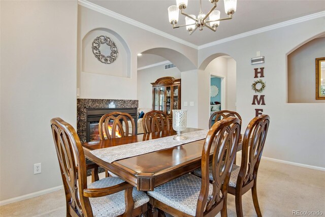 15501 E 112th Ave Unit 33D, Commerce City, CO 80022 - dining room with crown molding, baseboards, a notable chandelier, and light carpet