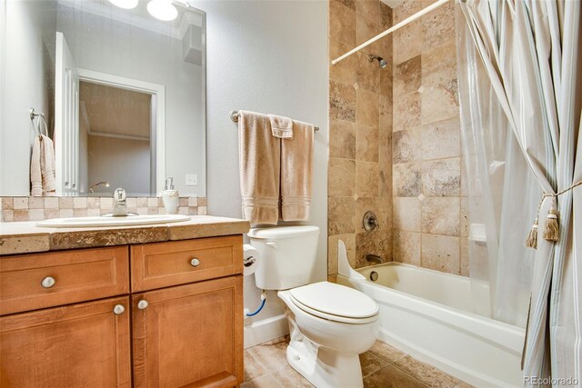 15501 E 112th Ave Unit 33D, Commerce City, CO 80022 - bathroom featuring toilet, shower / tub combo with curtain, and vanity