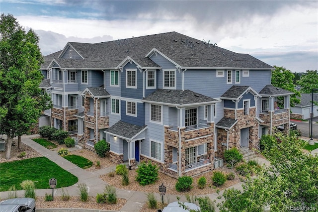 5255 Memphis St Unit 1009, Denver, CO 80239 - view of front of house featuring stone siding