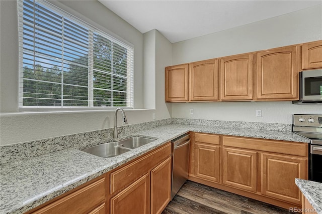5255 Memphis St Unit 1009, Denver, CO 80239 - kitchen with appliances with stainless steel finishes, dark wood-style flooring, and light stone counters