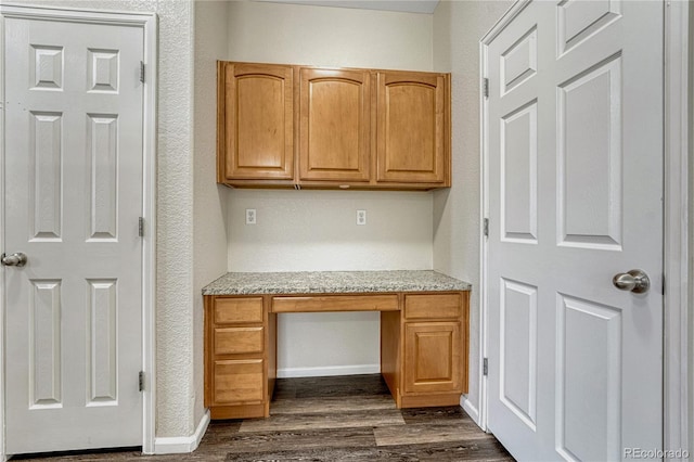5255 Memphis St Unit 1009, Denver, CO 80239 - unfurnished office with built in study area and dark wood-style floors
