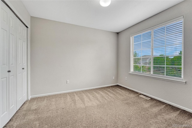 5255 Memphis St Unit 1009, Denver, CO 80239 - unfurnished bedroom with carpet and a closet