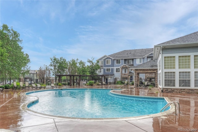 5255 Memphis St Unit 1009, Denver, CO 80239 - community pool featuring a patio area and a residential view