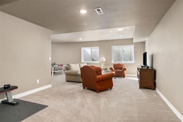 6690 S Fenton St, Littleton, CO 80123 - living area with baseboards, light colored carpet, recessed lighting, and visible vents