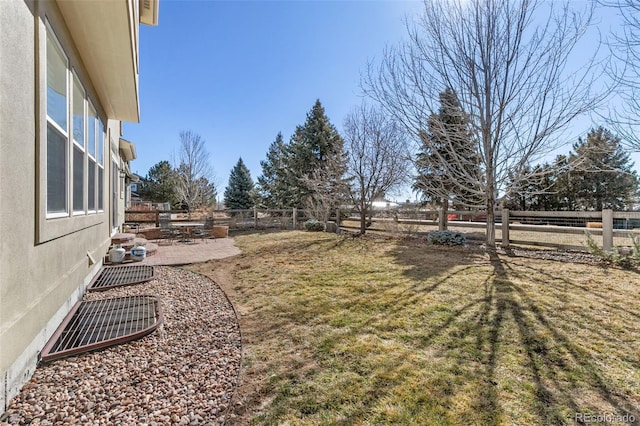 6690 S Fenton St, Littleton, CO 80123 - view of yard featuring a fenced backyard and a patio area