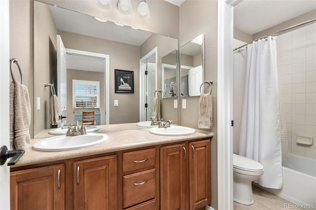 6690 S Fenton St, Littleton, CO 80123 - bathroom with toilet, double vanity, shower / tub combo, and tile patterned flooring