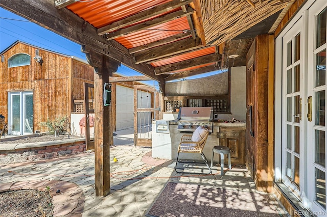 view of patio / terrace with french doors and exterior kitchen