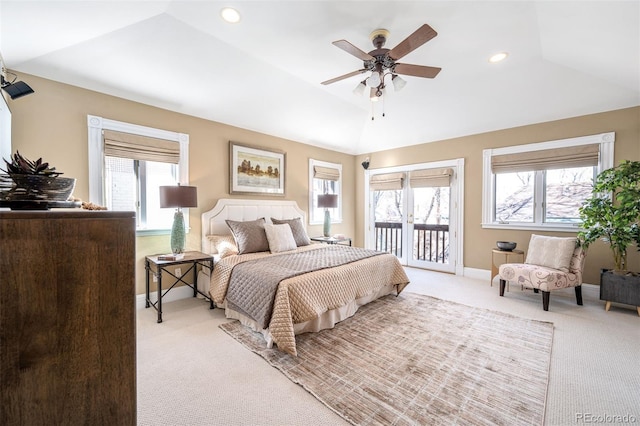 bedroom with light colored carpet, access to exterior, multiple windows, lofted ceiling, and baseboards