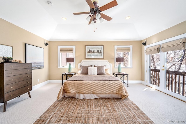 bedroom with light carpet, access to outside, baseboards, multiple windows, and recessed lighting