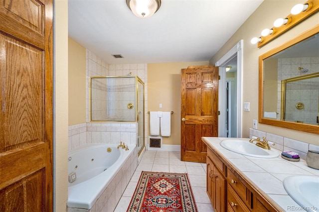 bathroom with a stall shower, a whirlpool tub, tile patterned flooring, and double vanity