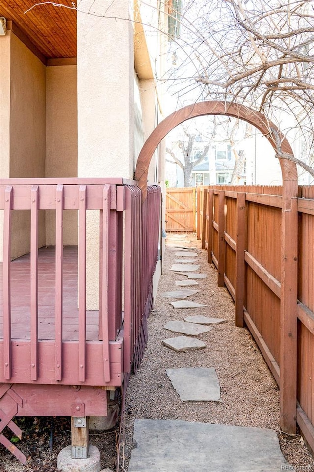 fenced backyard featuring a wooden deck
