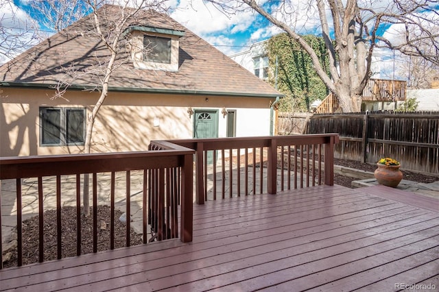 wooden deck featuring a fenced backyard