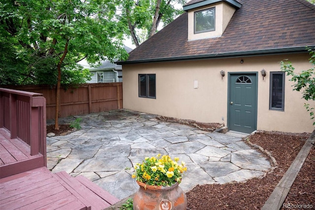 433 N Ogden St, Denver, CO 80218 - rear view of house featuring stucco siding, roof with shingles, a patio area, and a deck