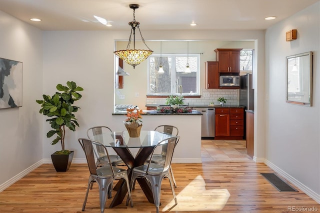 dining area featuring light hardwood / wood-style floors