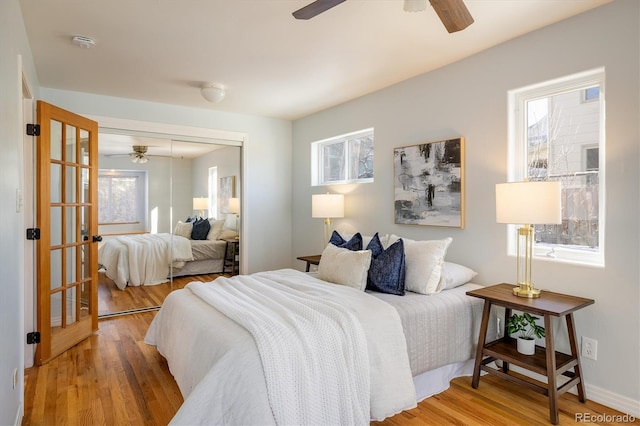 bedroom featuring hardwood / wood-style floors and a closet