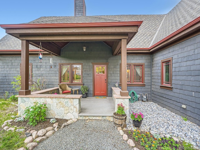845 Urban St, Lakewood, CO 80401 - entrance to property with a shingled roof and a chimney