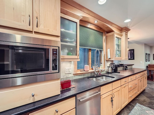 845 Urban St, Lakewood, CO 80401 - kitchen with stainless steel appliances, light brown cabinets, a sink, glass insert cabinets, and recessed lighting
