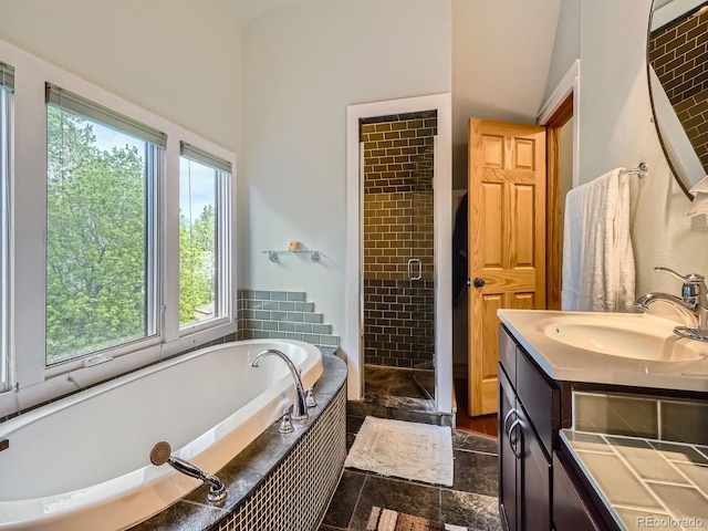 845 Urban St, Lakewood, CO 80401 - bathroom with a garden tub, a stall shower, vanity, and a high ceiling