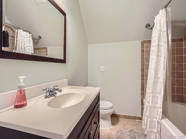 845 Urban St, Lakewood, CO 80401 - full bath with vanity, tile patterned floors, toilet, shower / tub combo, and lofted ceiling