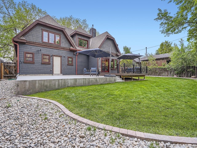 845 Urban St, Lakewood, CO 80401 - back of house with a deck, roof with shingles, a gazebo, and a chimney