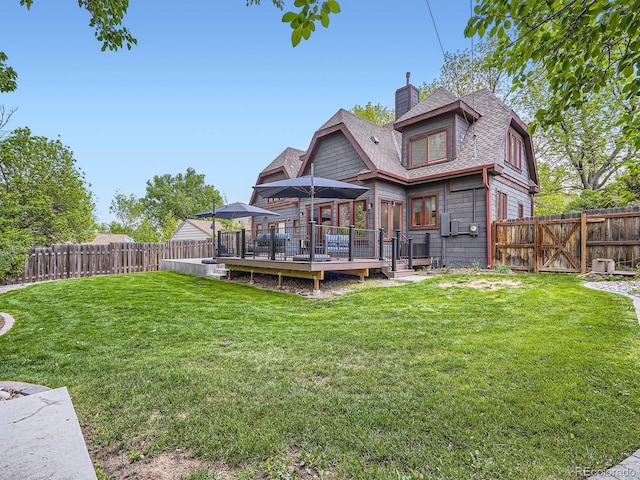 845 Urban St, Lakewood, CO 80401 - rear view of property with a chimney, roof with shingles, a deck, and a gate