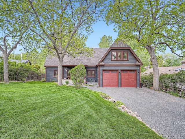 845 Urban St, Lakewood, CO 80401 - view of front of property with driveway and a shingled roof