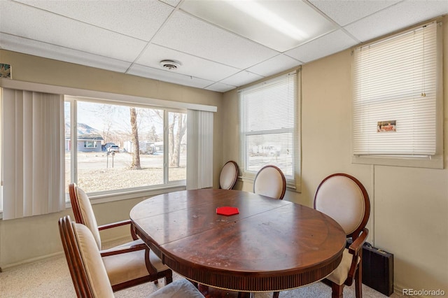 dining room with a drop ceiling