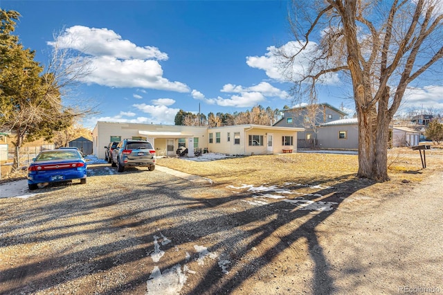 ranch-style home with a carport