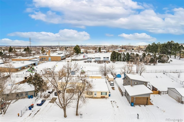 snowy aerial view with a residential view