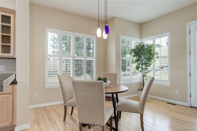 dining space featuring light hardwood / wood-style flooring