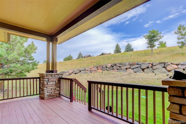 deck featuring a lawn