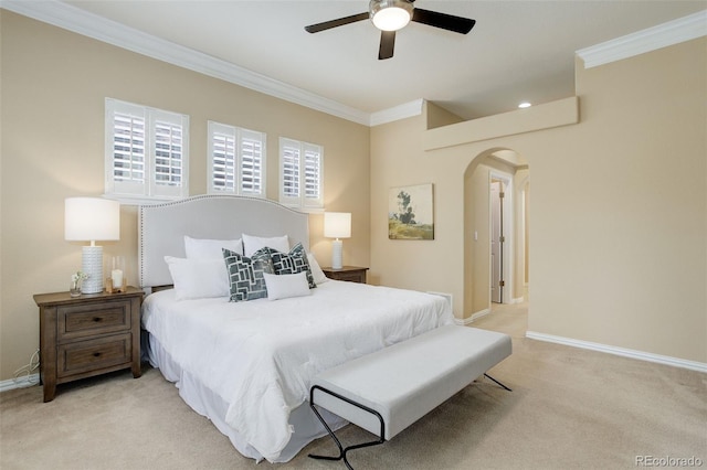 bedroom featuring light carpet, crown molding, and ceiling fan