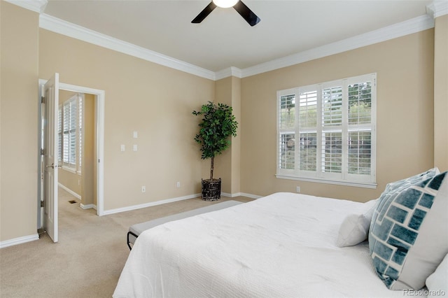 bedroom featuring crown molding, multiple windows, and light carpet