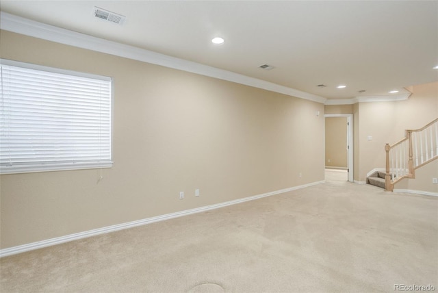 carpeted empty room with ornamental molding