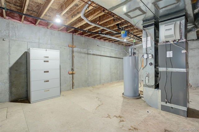 basement featuring heating unit and water heater