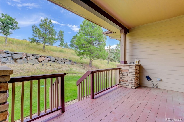 wooden deck with a yard