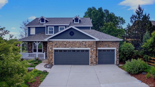 14620 Prairie Sky Ln, Broomfield, CO 80023 - craftsman house with a garage, concrete driveway, stone siding, and a shingled roof