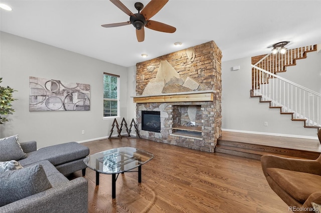 14620 Prairie Sky Ln, Broomfield, CO 80023 - living room with stairway, a ceiling fan, wood finished floors, and a fireplace