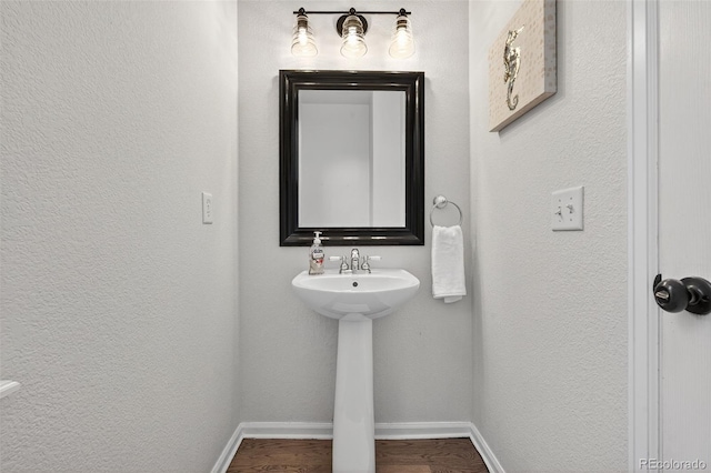 14620 Prairie Sky Ln, Broomfield, CO 80023 - bathroom with wood finished floors and a textured wall