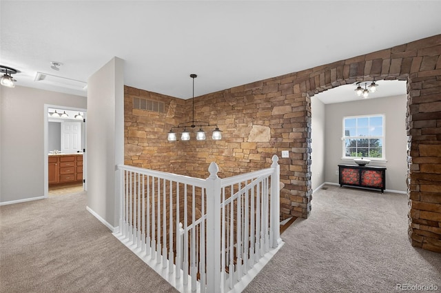 14620 Prairie Sky Ln, Broomfield, CO 80023 - hall featuring carpet flooring, an upstairs landing, and a chandelier