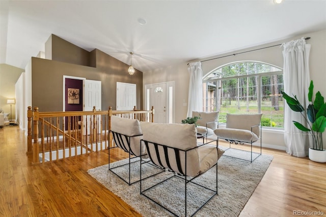 19770 Roaming Dr, Colorado Springs, CO 80908 - living area with wood finished floors and high vaulted ceiling