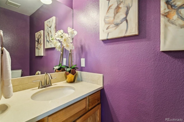 19770 Roaming Dr, Colorado Springs, CO 80908 - bathroom with vanity and a textured wall