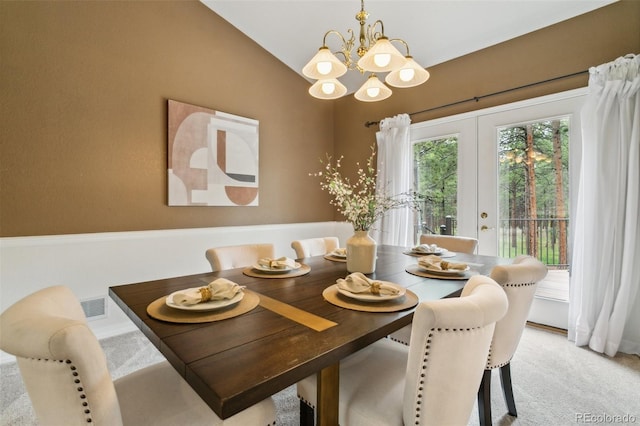 19770 Roaming Dr, Colorado Springs, CO 80908 - dining room with a chandelier, vaulted ceiling, light carpet, and french doors