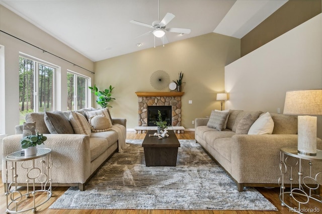 19770 Roaming Dr, Colorado Springs, CO 80908 - living area with wood finished floors, lofted ceiling, ceiling fan, and a fireplace