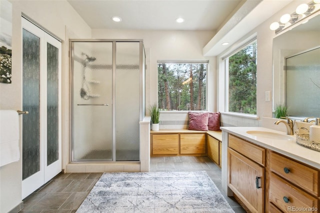 19770 Roaming Dr, Colorado Springs, CO 80908 - full bathroom featuring a stall shower, vanity, and recessed lighting
