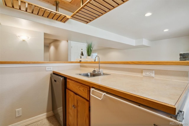 19770 Roaming Dr, Colorado Springs, CO 80908 - kitchen with dishwasher, light countertops, brown cabinetry, and recessed lighting