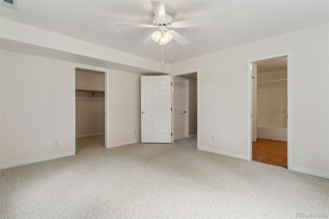 19770 Roaming Dr, Colorado Springs, CO 80908 - unfurnished bedroom featuring carpet flooring, a spacious closet, a closet, and ceiling fan