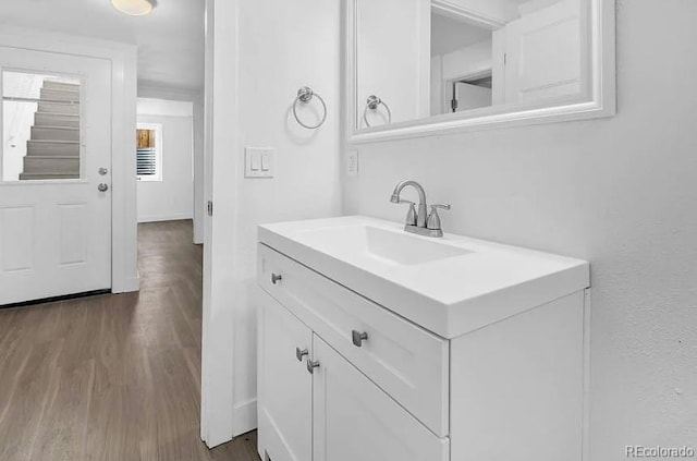 bathroom featuring wood finished floors and vanity