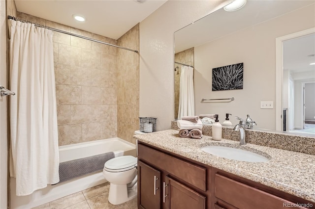 full bathroom with vanity, tile patterned floors, toilet, and shower / bath combo with shower curtain